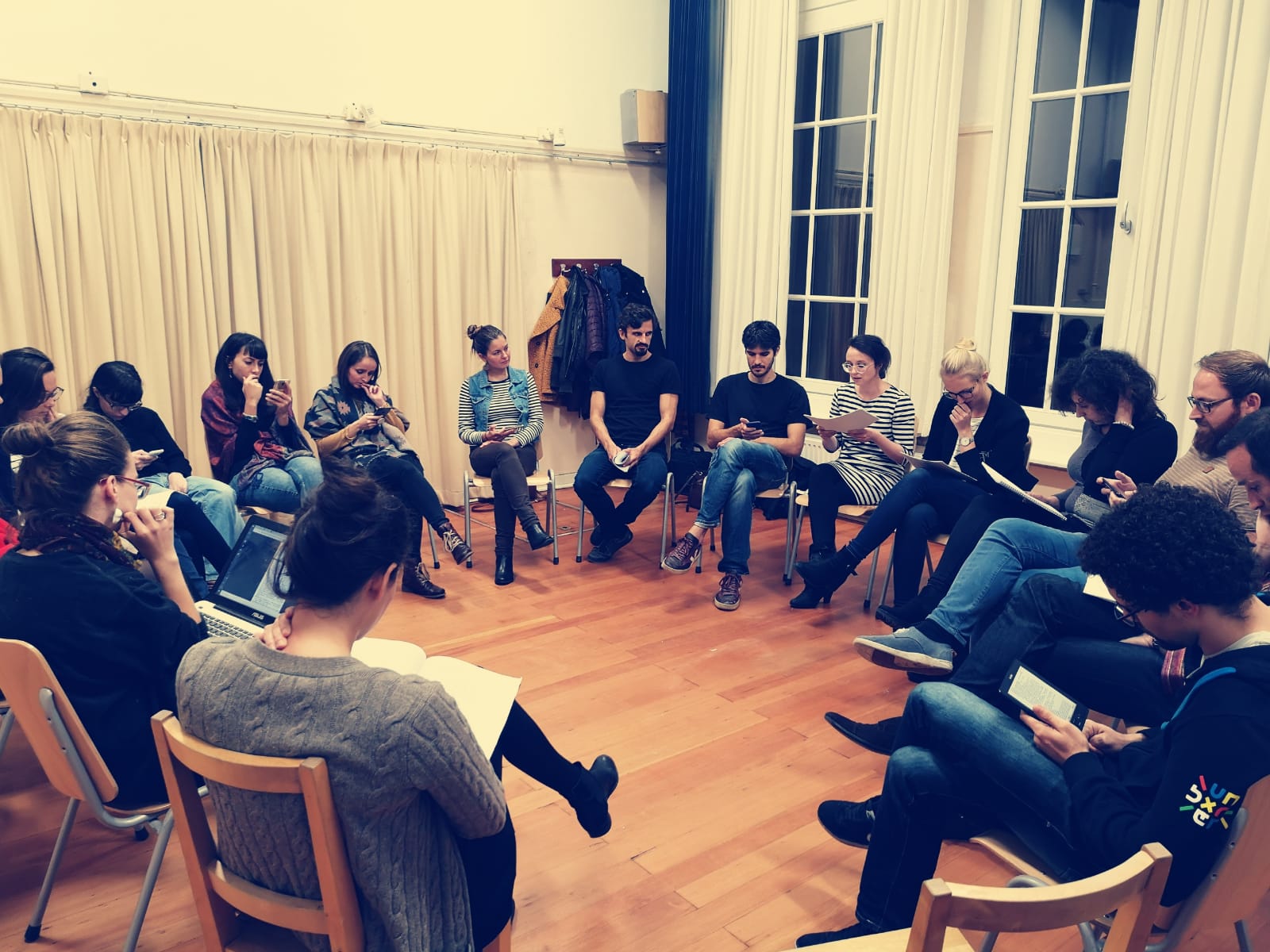Acting Class Beginners, group of people is sitting on chars in a circle